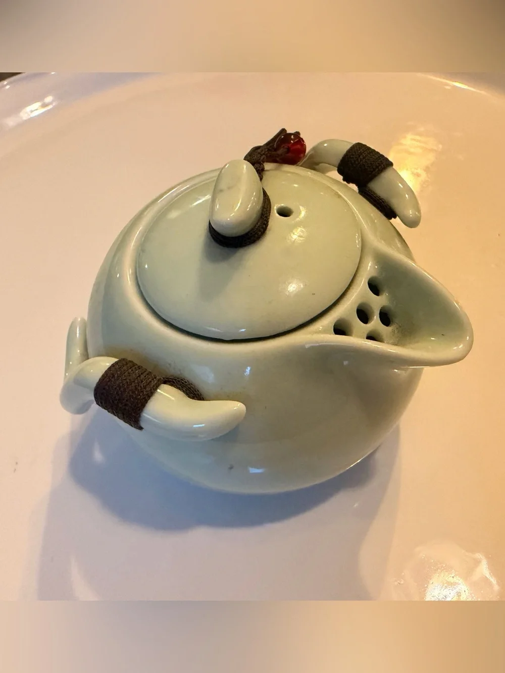 Ceramic Pale Green Mini Teapot with Integrates Strainer,Brown Cord and Red Beads